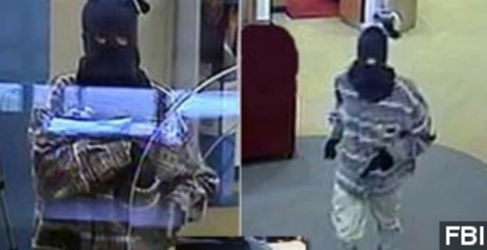 Manhunt Underway For Robber Suspected In Officer's Death