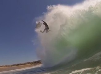 Bodyboarder getting pitched over the falls at the Wedge