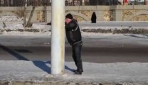 Drunk russian guy fighting against a stake.
