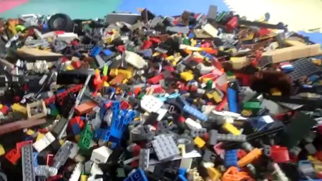 Man Performs Backflip Onto Pile of Lego