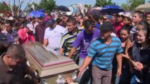 Mexican vigilantes bury their dead