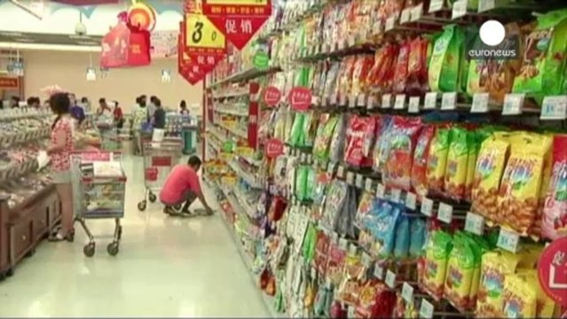 China's growth narrowly down as investors hunker down for reforms.