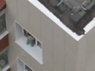 Baby walking on windowsill, at the 11th floor of a building. Dumb...