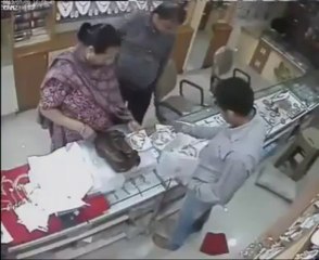 Lady Stealing Gold From Shop