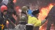 Riot police beat up protesters in the Ukrainian capital Kiev