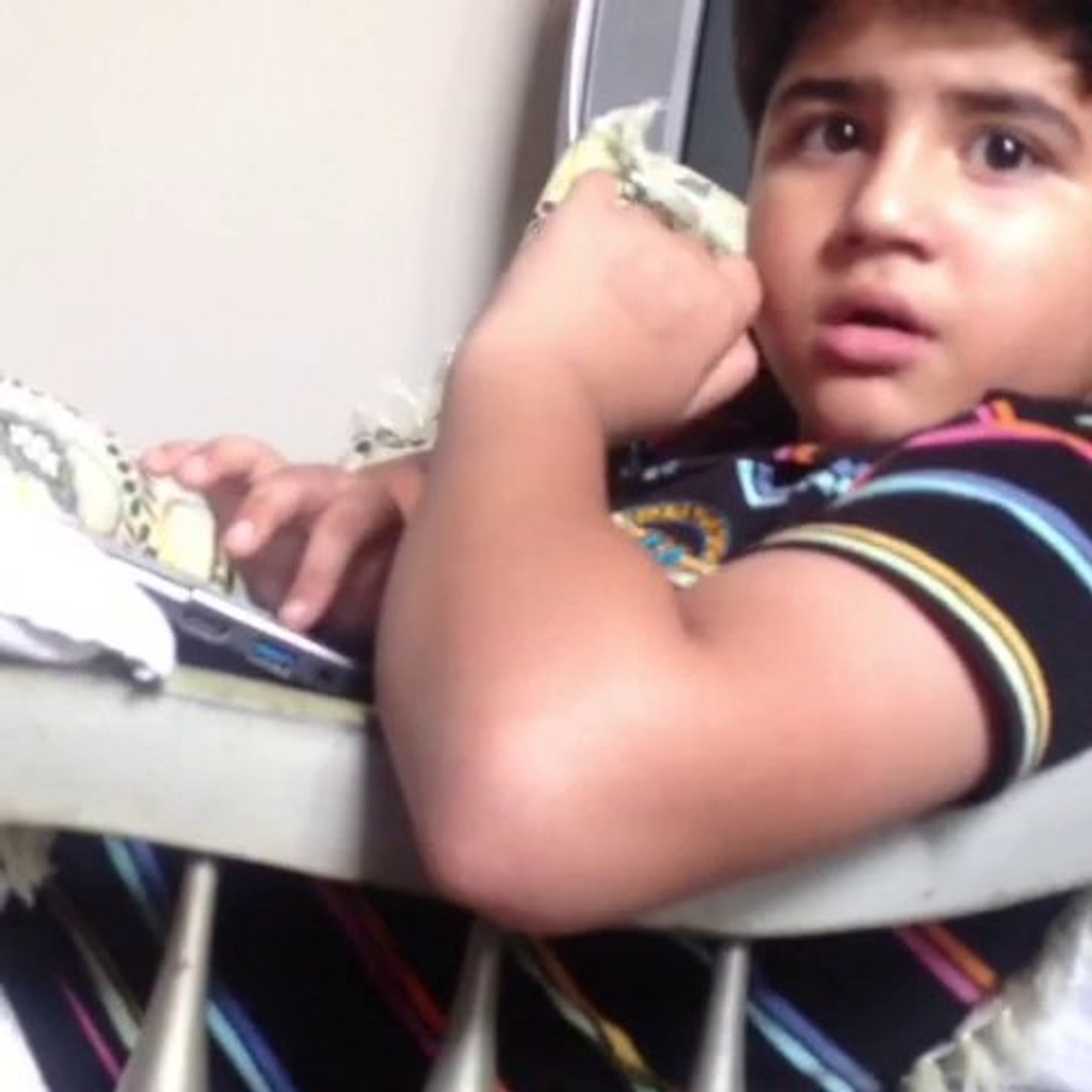 ⁣Abdullah playing game on laptop