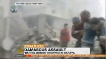 Barrel bombs hit Syrian suburb of Daraya