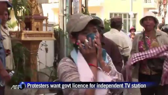 Cambodia police use smoke grenades to break up rally
