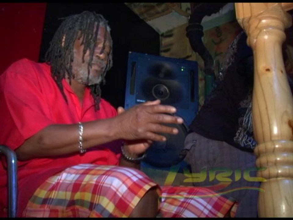 Ken Booth and Horace Andy burning a fire on Mussolini