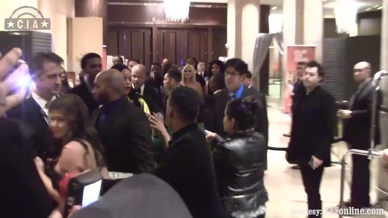 Rihanna Stuns In Deep Plunging, Thigh Exposing Gown At Clive Davis' Pre-Grammy Party