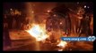 الأهالي يشعلون النيران في سيارة إخواني رفع إشارة رابعة في جنازة شهداء المنصورة