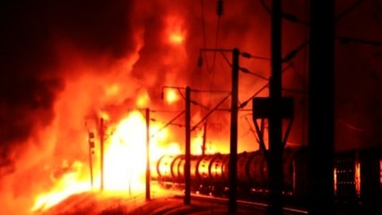 Fire spreads after train derails in Russia