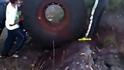 Huge Tire Bouncing Downhill Into Lake