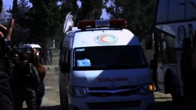 Busloads of Syrians evacuate Homs