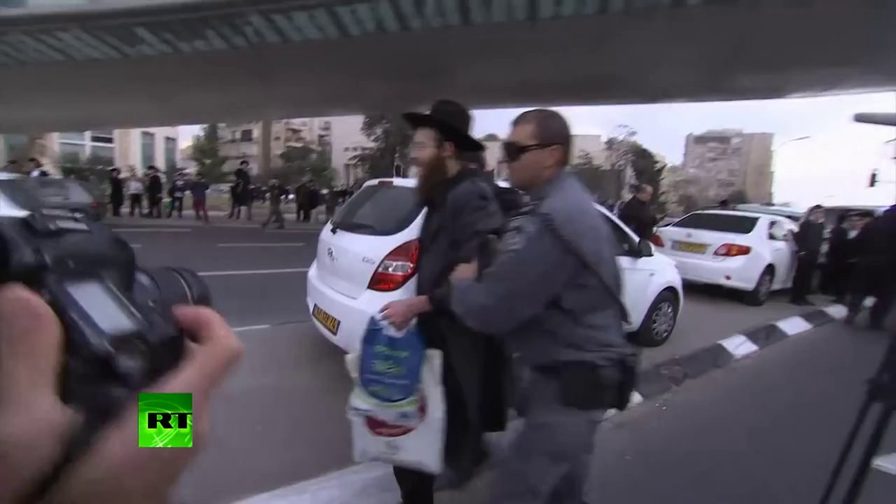 Jews v Cops: Ultra-Orthodox protest against plan to draft them into IDF
