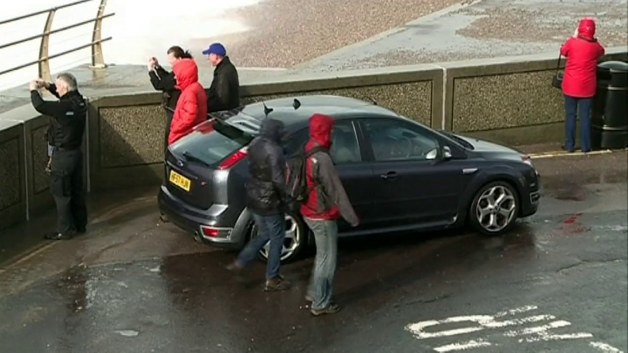 Giant waves in Dorset: Policemen and prams get soaked