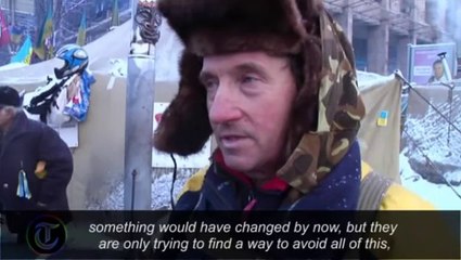 Ukraine: protesters man tyre barricades as they call for 'more radical action'