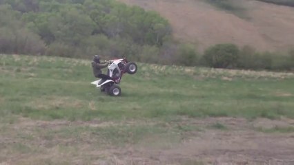 Dirt Bike And ATV Wheelie Across A Field