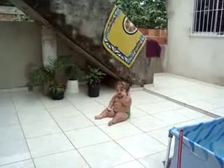 cute weird baby slides around on tiles