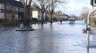 Oxford floods: residents take to dinghy as road floods