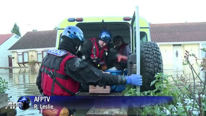 British police, army rescue vulnerable from floods