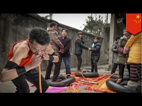 Chinese man uses nose to blow up tires