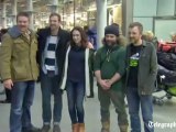 Defiant Greenpeace activists arrive back in Britain