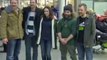 Defiant Greenpeace activists arrive back in Britain