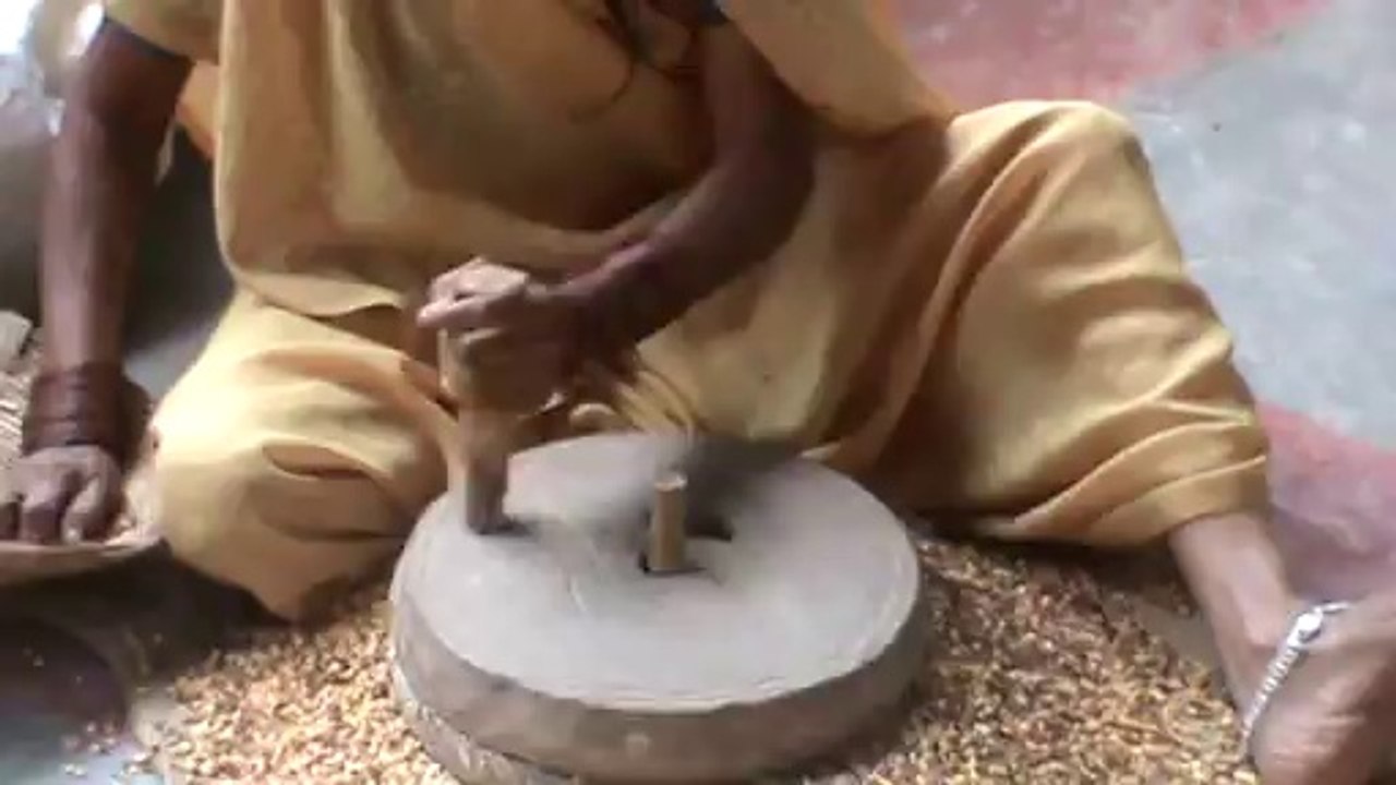 Indian Woman Grinding Grain