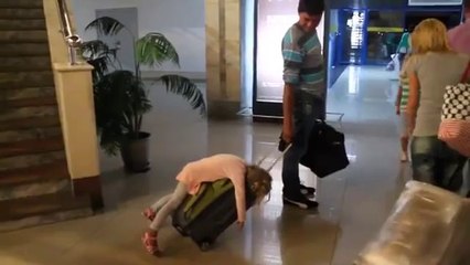 Baby sleeping on Luggage bag