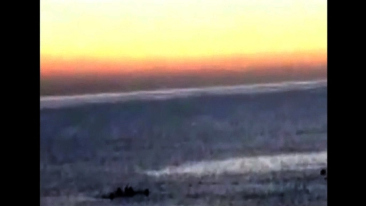 Spanish police fire rubber bullets as migrants try to swim to Spain