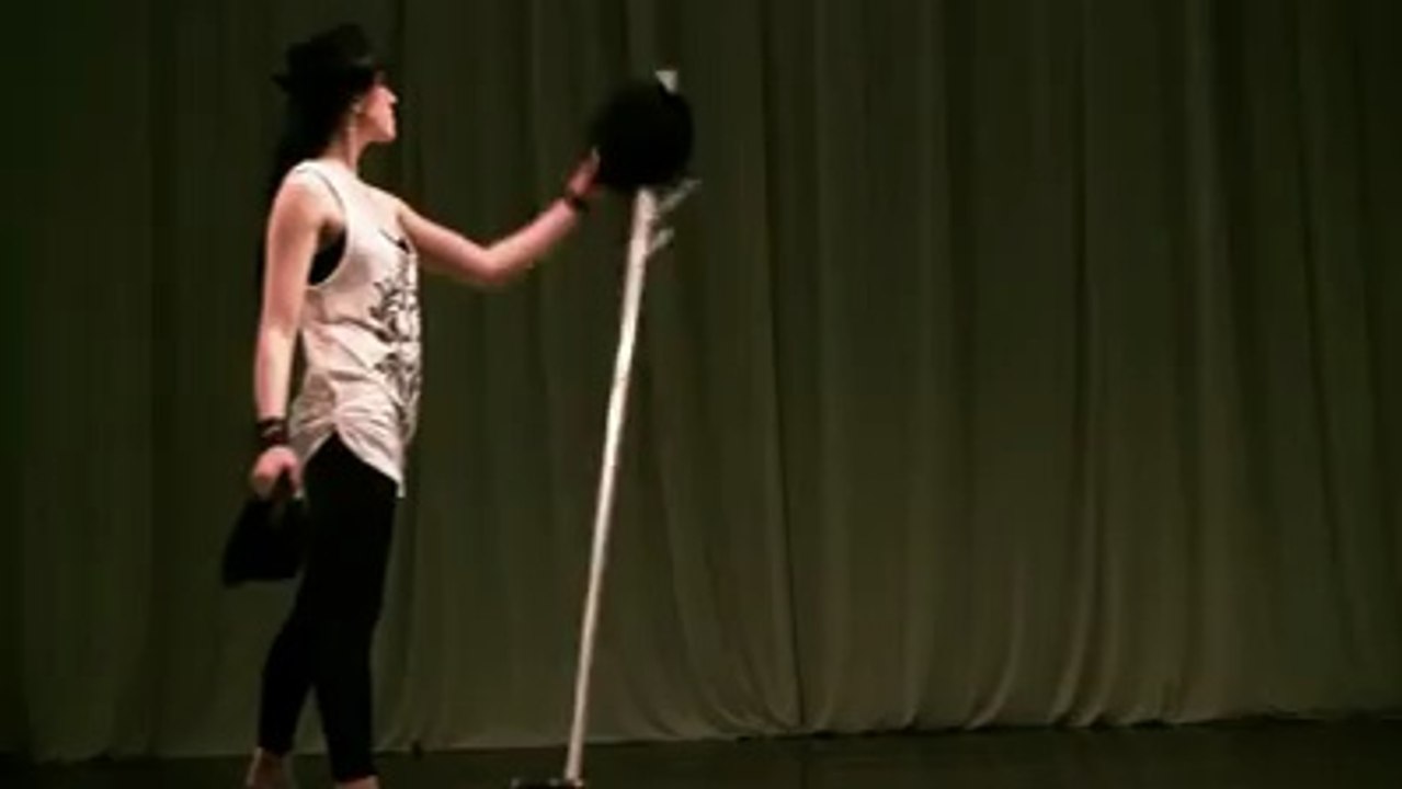 Girl Juggling Hats