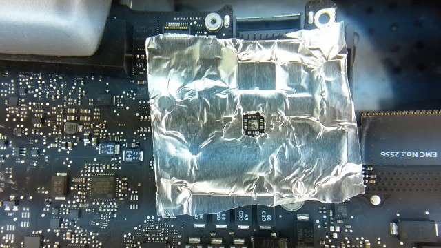 Apple logic board repair to solder the charging circuit QFP back after a short has damaged it