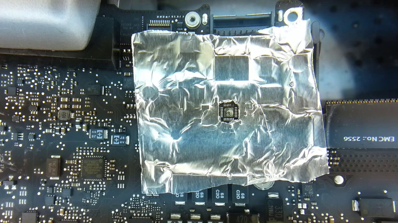 Apple logic board repair to solder the charging circuit QFP back after a short has damaged it