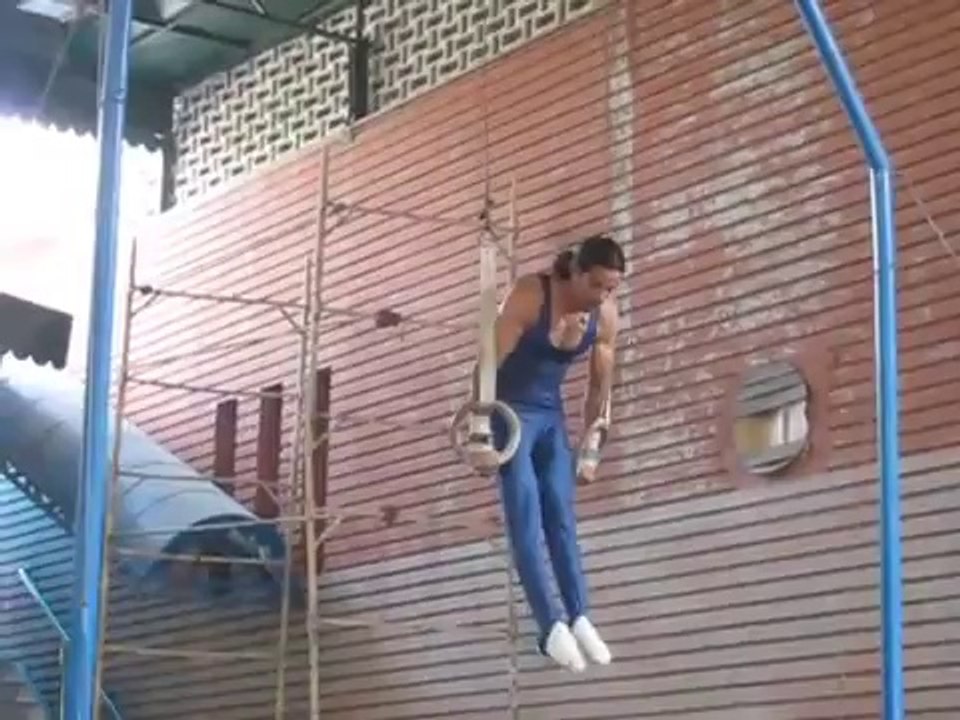 GYMNASTICS CHAMPION (2012) AFFAN REHMAN PERFORMING ON RINGS