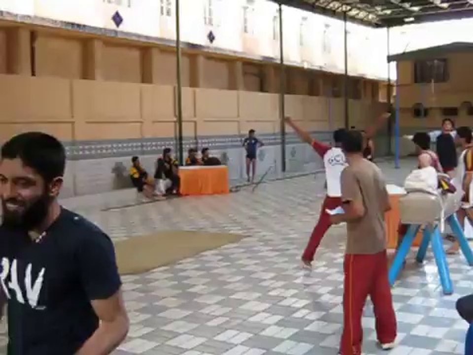 GYMNASTICS CHAMPION (2012) AFFAN REHMAN PERFORMING ON VAULTING TABLE