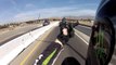 Car drives over freeway interchange and nearly hits motorcycle