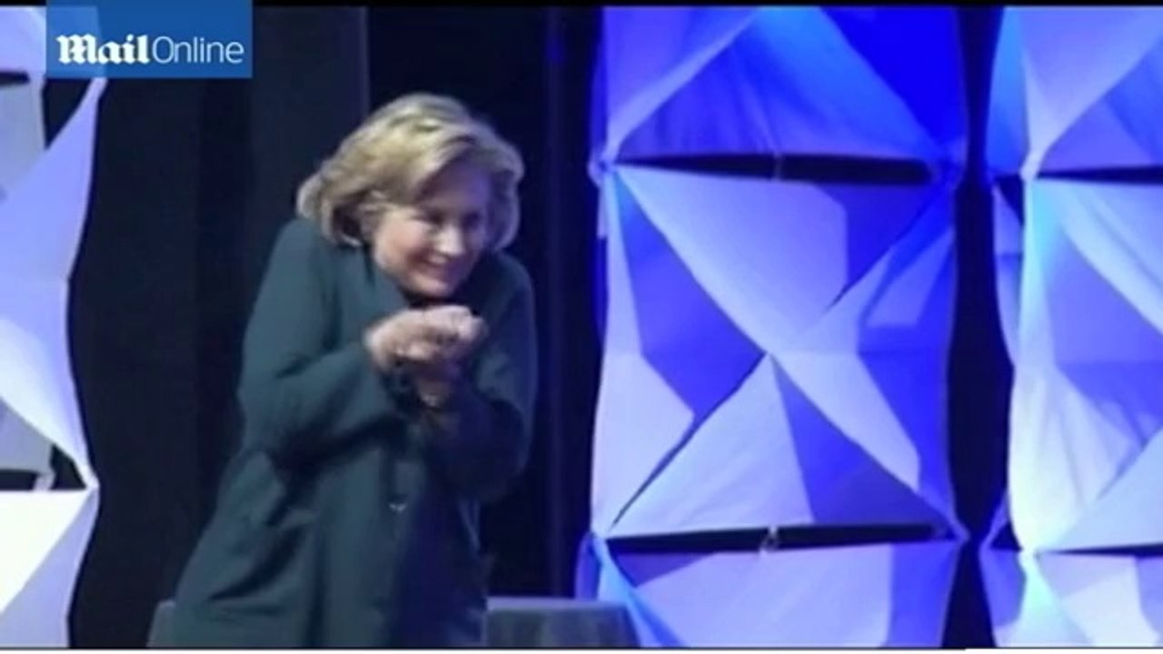 Woman throws shoe at Hillary Clinton