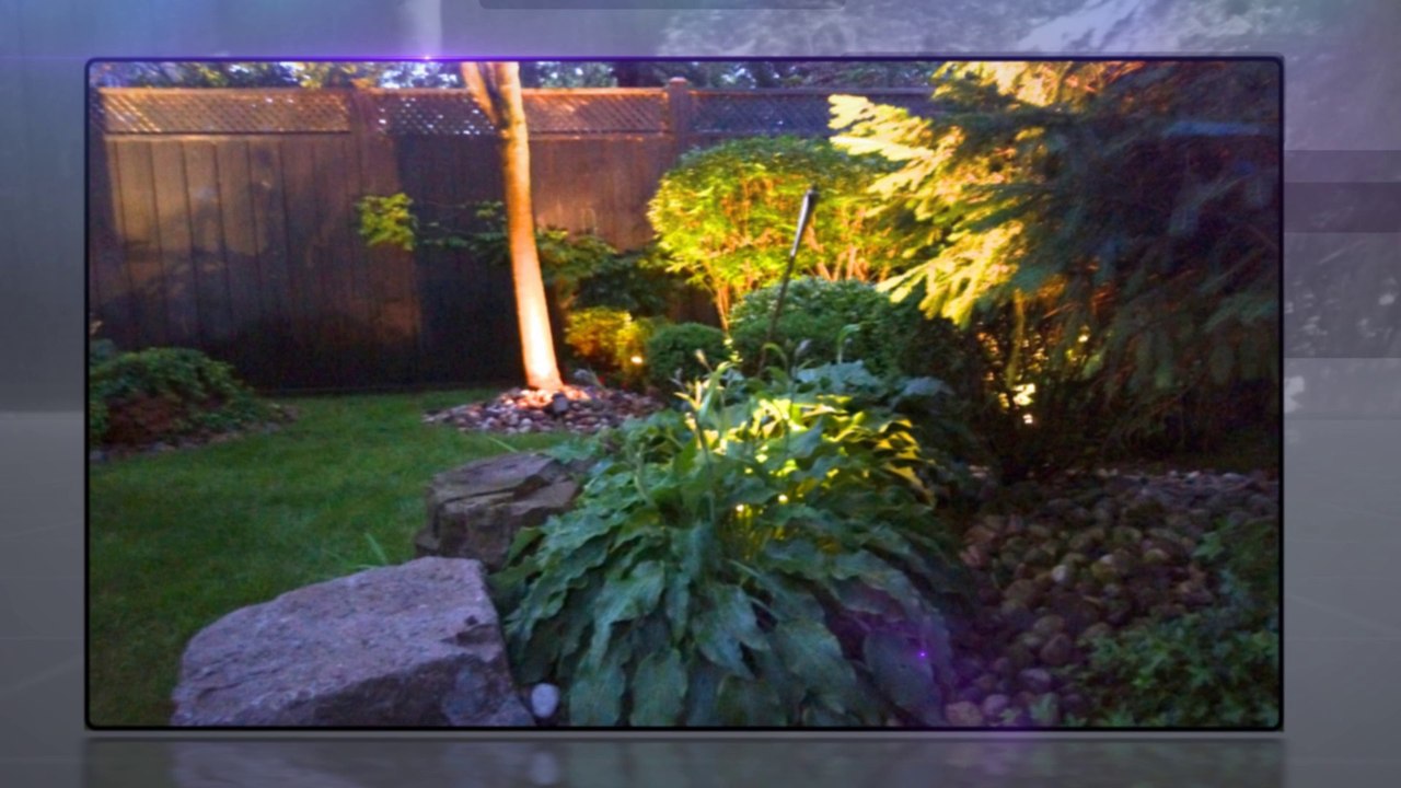 Full landscaping project with PVC deck and glass railings