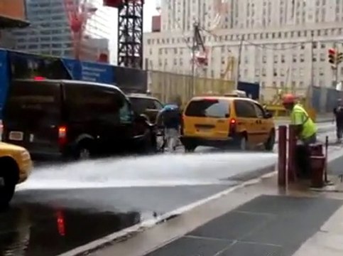 Violent Biker Fail in the street... Falling down because of water