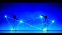 Japanese dancers using lights in their performance is hypnotizing