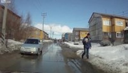 Russian Pedestrian Nearly Disappears Under Snow