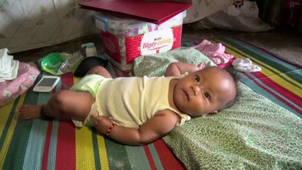 Philippines: Bea Joy, enfant du typhon, grandit face aux flots meurtriers