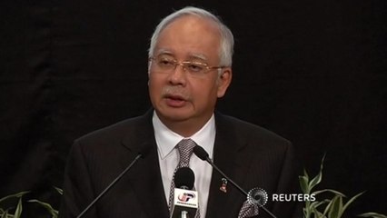 Malaysia PM tells families of missing jet, passenger plane is lost