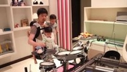 Dad Plays Killer One-Armed Drum Cover While Holding Three Kids