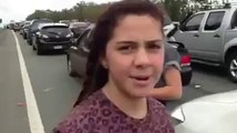 Girls dance in road side when  trafic jam