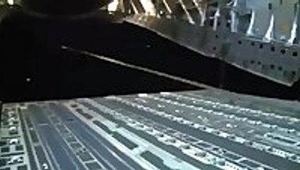 Military trucks dropped from airplane during night