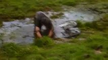 Downhill biker falls face first into mud