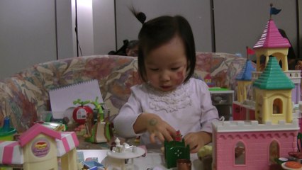 Girl Putting Doll To Bed