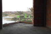 villa for sale in katameya dunes devided into 2 villas over looking the lake and golf